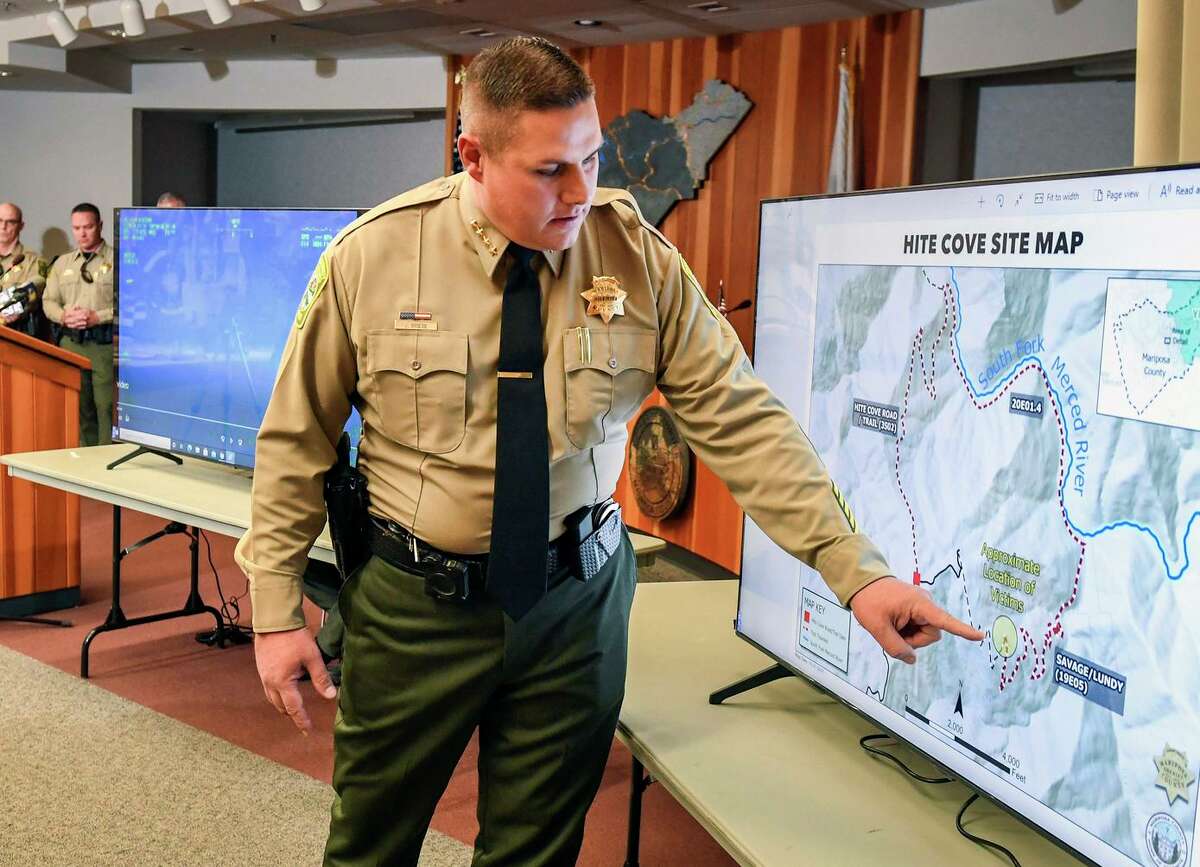 Mariposa County Sheriff Jeremy Briese points to a map to show where a missing family was found dead.