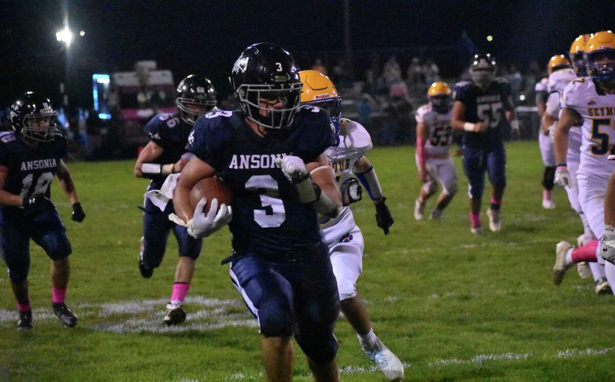 Ansonia's David Cassetti runs with the ball during in a football game between Ansonia and Seymour at Nolan Field, Ansonia on Thursday, Oct. 21, 2021.