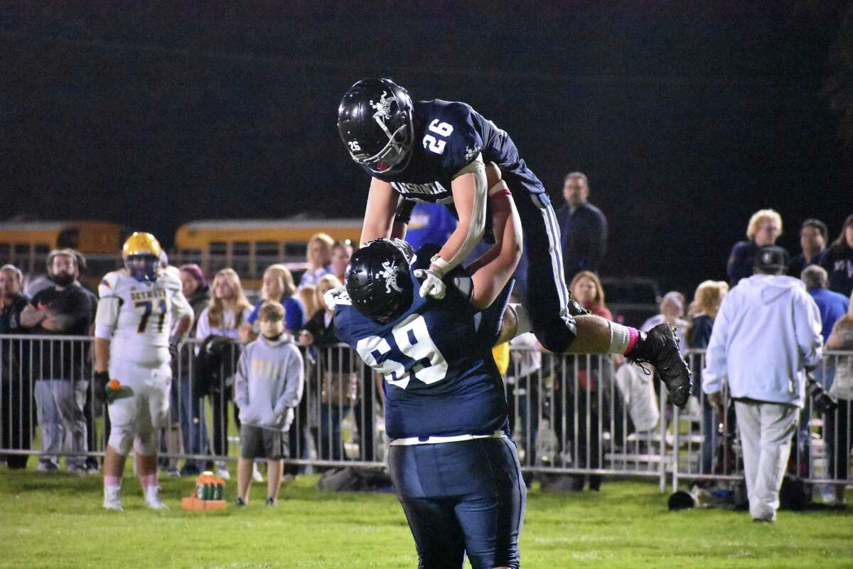 Ansonia’s Preston Dziubina is lifted up after scoring a touchdown during a game against Seymour on Thursday at Nolan Field in Ansonia.