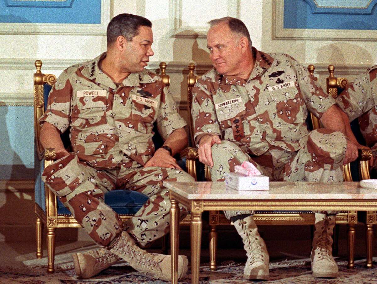 Chairman of the Joint Chiefs of Staff Gen. Colin Powell confers with Gen. H. Norman Schwarzkopf at a central Saudi Arabia air base in 1991. During the Gulf War the two applied the lessons they’d learned in Southeast Asia decades before.