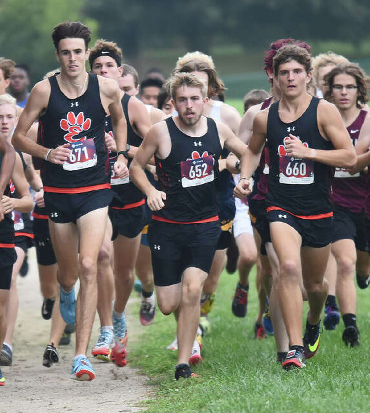 Edwardsville’s Ryan Watts, left, Jacob Grandone, center, and Ryan Luitjohan compete in the Southwestern Conference Meet at Belleville West.