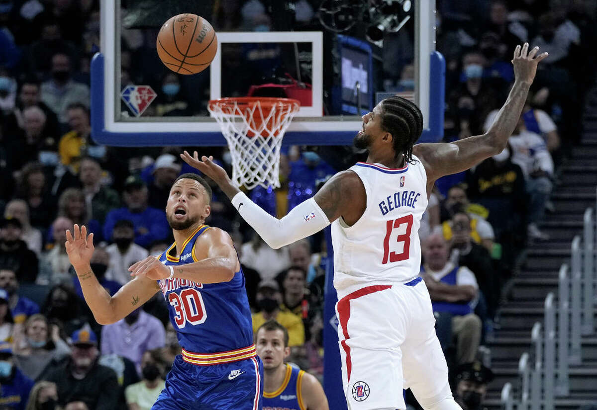 Stephen Curry of the Golden State Warriors steals the ball from Paul George of the LA Clippers during the second quarter at Chase Center.