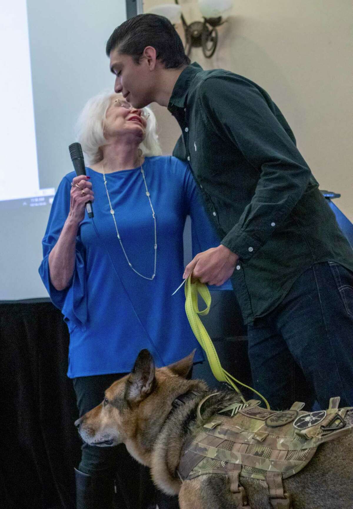 Alec Matthew Alcoser, wounded U.S. Army veteran, hugs Marie Underdown, SPCA PETS SNAP of Montgomery County chairwoman, after she presented him a $500 check to aid in medical expenses for his Army K-9 Alex on Saturday, October 26, 2019 during the SPCA PETS SNAP of Montgomery County Pooches and Patriots Luncheoon and Fashion Show at at April Sound Country Club in Montgomery.