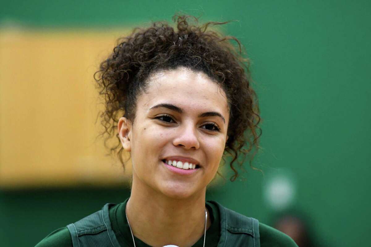 Siena basketball player Valencia Fontenelle-Posson of Guilderland suffered hearing loss as a result of multiple ear infections and wears a hearing aid on her right ear.