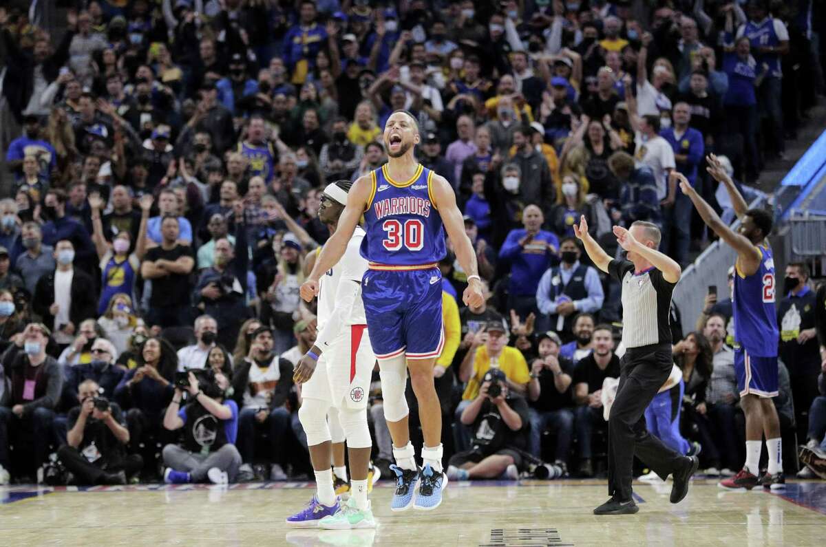 Stephen Curry reacts after a last-second shot by the Clippers came after the buzzer and the Golden State Warriors held on to win 115-113 at Chase Center on Thursday.
