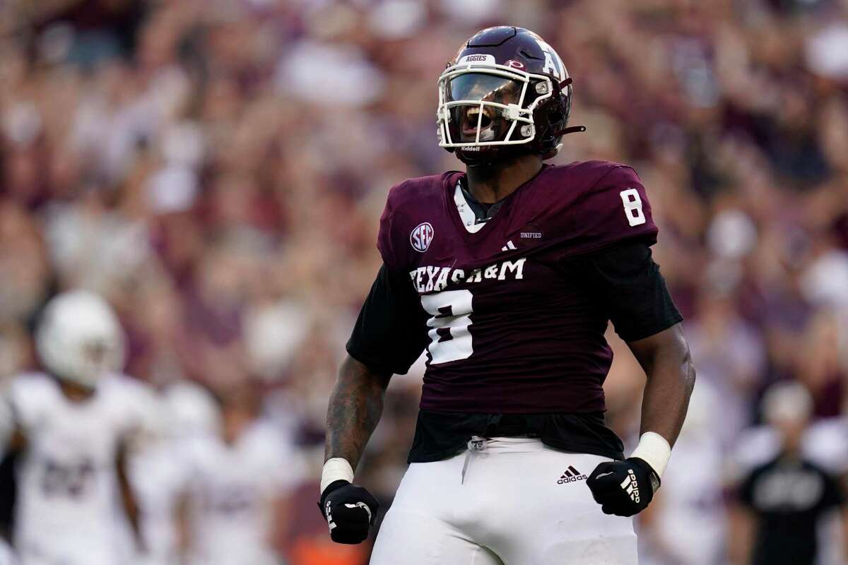 FILE - Texas A&M defensive lineman DeMarvin Leal (8) reacts after sacking Mississippi State quarterback Will Rogers (2) during the first quarter of an NCAA college football game in College Station, Texas, in this Saturday, Oct. 2, 2021, file photo. Leal was selected to The Associated Press Midseason All-America team, announced Tuesday, Oct. 19, 2021. (AP Photo/Sam Craft, File)