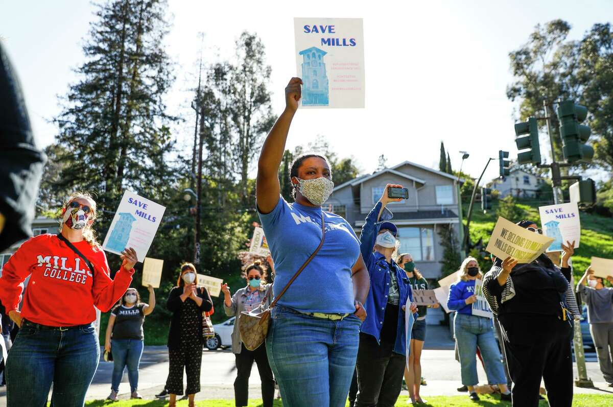 Protesters rally at Mills College in March after a closure announcement. Mills is now merging with Northeastern University.