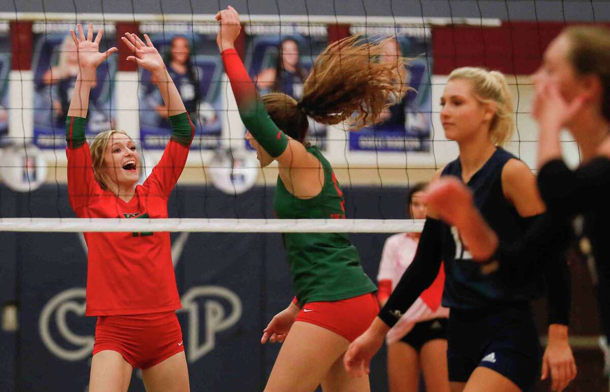 The Woodlands’ Molly Tuozzo (12) reacts after a point during the first set of a high school volleyball match at College Park High School, Friday, Oct. 22, 2021, in The Woodlands.