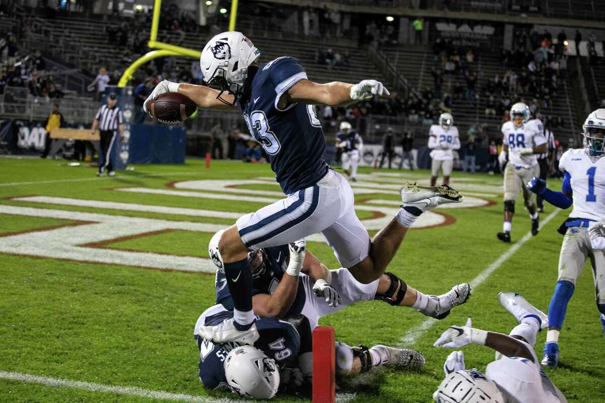UConn tight end Brandon Niemenski (83) scores on an 8-yard touchdown reception against Middle Tennessee State on Friday in East Hartford.