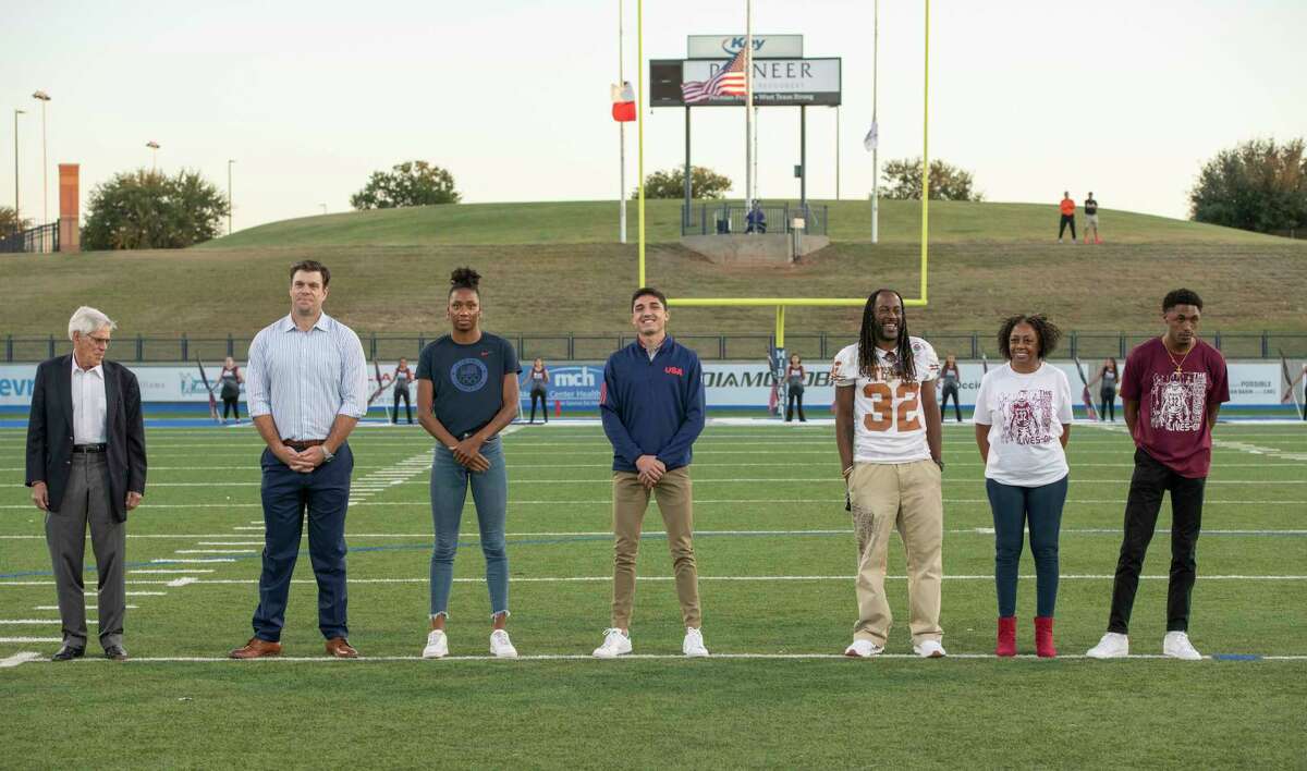 Tevis Herd, Eric Winston, Natalie Hinds, Bryce Hoppel and Cedric Benson, represented by his brother Dominic, mother Jackie and brother Deondric 10/22/2021 at Grande Communications Stadium, as they are inducted into the Midland ISD Hall of Legends. Tim Fischer/Reporter-Telegram