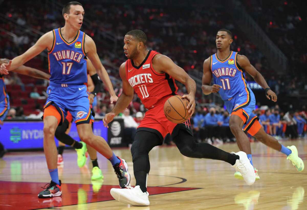 Houston Rockets guard Eric Gordon (10) drives to the basket while Oklahoma City Thunder forward Aleksej Pokusevski (17) defends during the first quarter of an NBA game Friday, Oct. 22, 2021, at the Toyota Center in Houston.