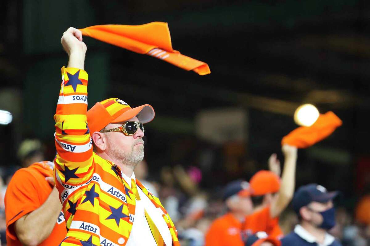 An Astros fan waves his rally towel during the third inning in Game 6 of the American League Championship Series on Friday, Oct. 22, 2021 at Minute Maid Park in Houston.