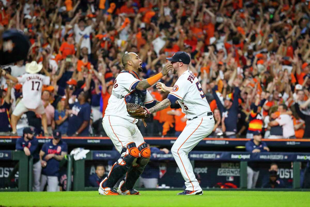 Houston Astros relief pitcher Ryan Pressly (55) celebrates with Houston Astros catcher Martin Maldonado (15) as Boston Red Sox shortstop Xander Bogaerts (2) lines out ended the ninth inning in Game 6 of the American League Championship Series on Friday, Oct. 22, 2021 at Minute Maid Park in Houston.