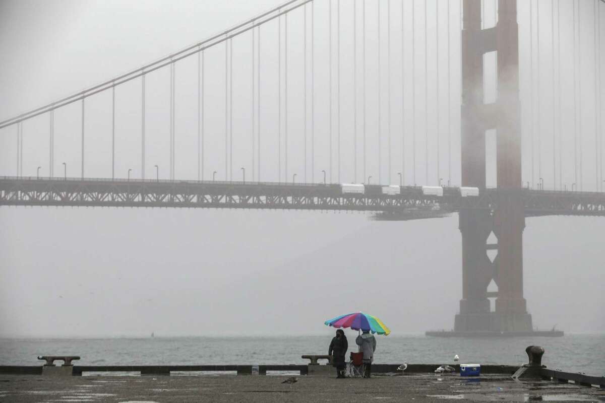 A misty view of the Golden Gate Bridge from Torpedo Wharf at Fort Point in San Francisco on Oct. 20, 2021.