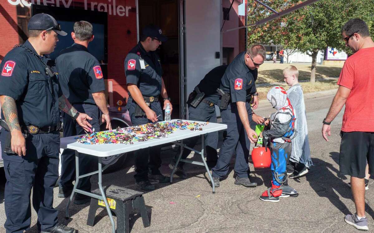 Children and families play games and gets treats 10/23/2021 at Central Fire Station during the Midland Fire Department's Truck or Treat Halloween fun and activities. Tim Fischer/Reporter-Telegram
