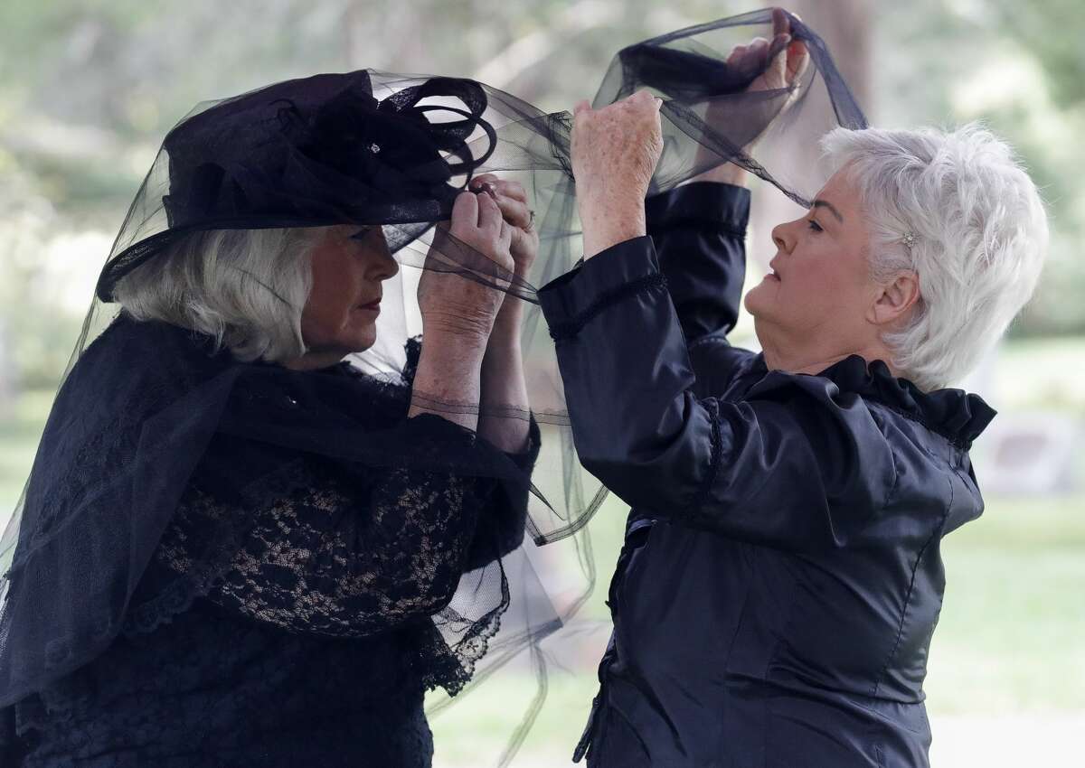 Eva Rains, right, helps Pat Spacky with her veil as the Montgomery Historical Society holds their annual Voices from the Past Cemetery tour on Saturday, October 23, 2021, in Montgomery. Reenactors, dressed in period clothing, led small-group tours to each of the city's three historic cemeteries for those interested in the region's long and colorful history and genealogy.