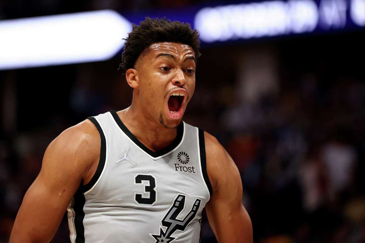 DENVER, CO - OCTOBER 22: Keldon Johnson #3 of the San Antonio Spurs reacts after scoring against the Denver Nuggets at Ball Arena on October 22, 2021 in Denver, Colorado. NOTE TO USER: User expressly acknowledges and agrees that, by downloading and or using this photograph, User is consenting to the terms and conditions of the Getty Images License Agreement. (Photo by Jamie Schwaberow/Getty Images)