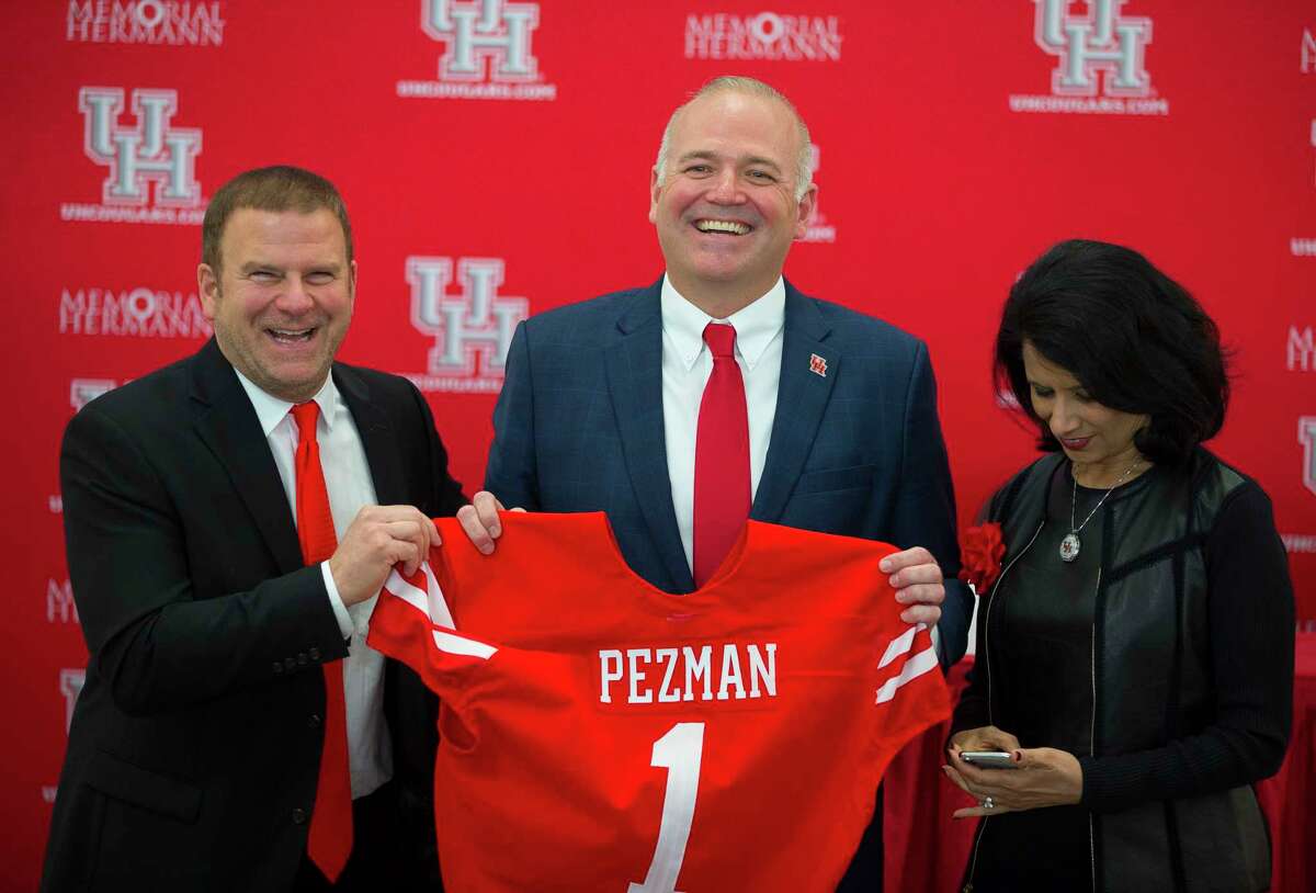 University of Houston board of regents chairman Tilman Fertitta (left), university chancellor Renu Khator (right) and athletic director Chris Pezman have envisioned joining a Power Five conference for years. It's officially happening July 1, 2023, with entry into the Big 12.