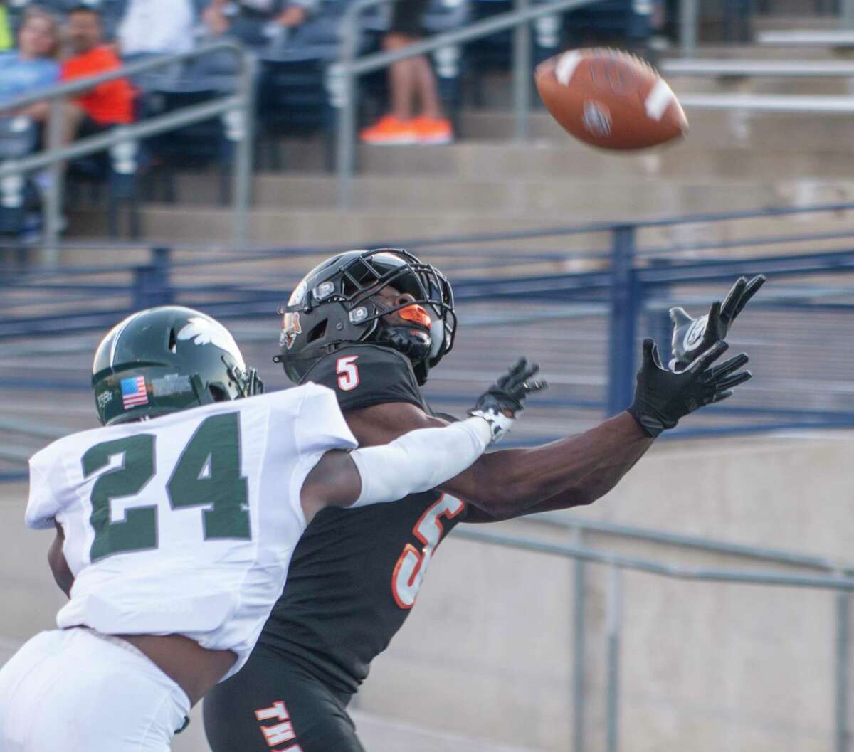 UTPB's MJ Link reaches for the pass as Eastern New Mexico's Lino Odenat covers 10/23/2021 at Grande Communications Stadium. Tim Fischer/Reporter-Telegram