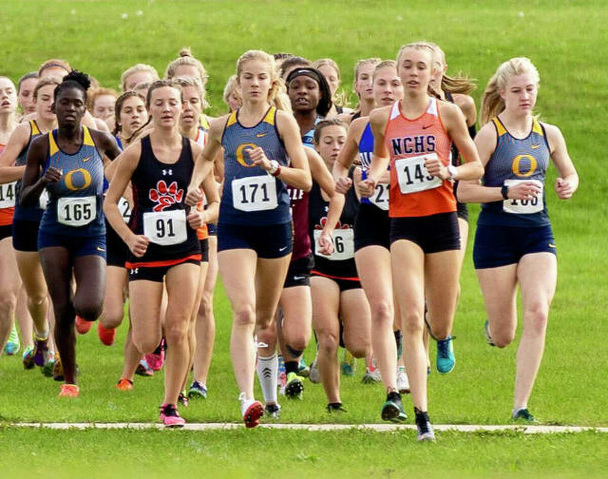 Edwardsville’s Emily Nuttall (No. 91) gets out to a strong start at the Class 3A Normal Community Regional inside Maxwell Park.