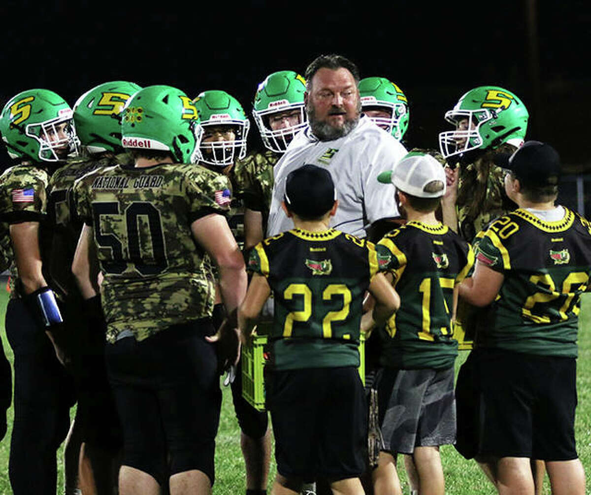 Southwestern coach Pat Keith talks with his team during a timeout in a Sept. 17 game at Knapp Field in Piasa. The Piasa Birds finished the regular season at 5-4 and will make their first playoff appearance since 2009 when they play at Benton.