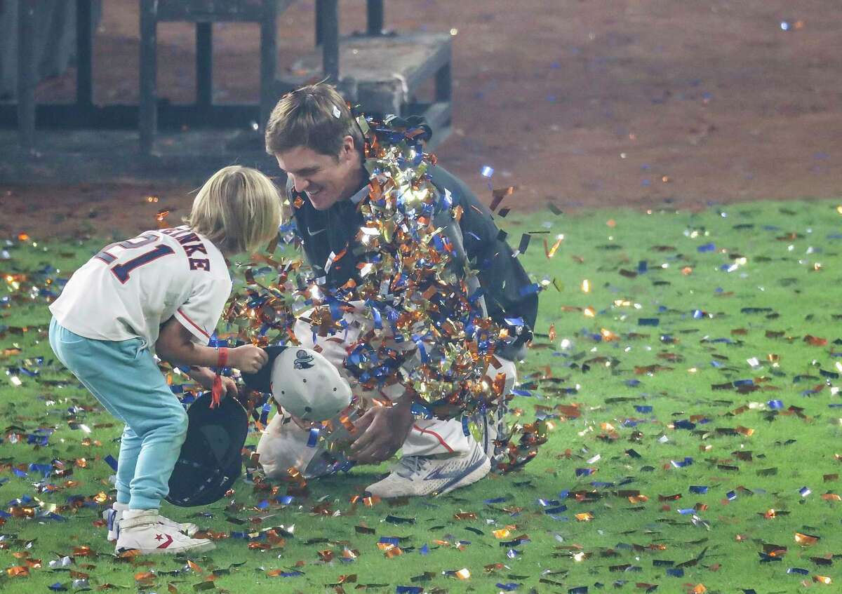 Houston Astros pitcher Zack Greinke (21) plays on the field with his kids as the Astros celebrate their win of Game 6 of the American League Championship Series on Friday, Oct. 22, 2021 at Minute Maid Park in Houston.