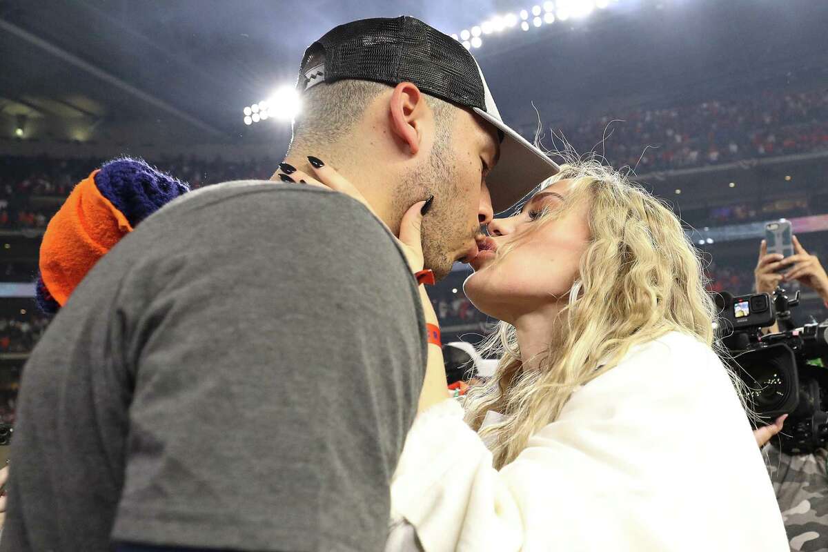 Carlos Correa #1 of the Houston Astros kisses his wife, Daniella Rodriguez, after defeating the Boston Red Sox 5-0 in Game Six of the American League Championship Series to advance to the World Series at Minute Maid Park on October 22, 2021 in Houston, Texas.