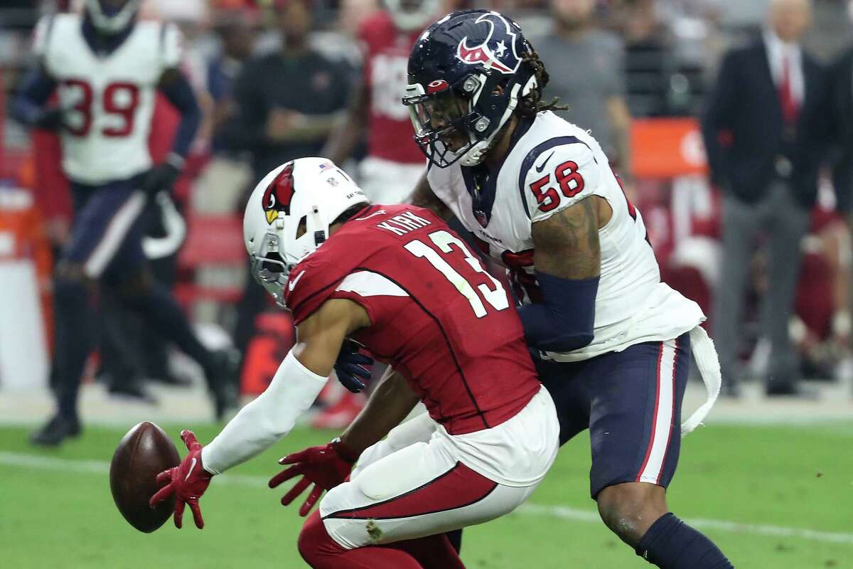 Houston Texans linebacker Christian Kirksey (58) breaks up a pass intended for Arizona Cardinals wide receiver Christian Kirk (13) during the second quarter of an NFL football game Sunday, Oct. 24, 2021, in Glendale, Ariz.