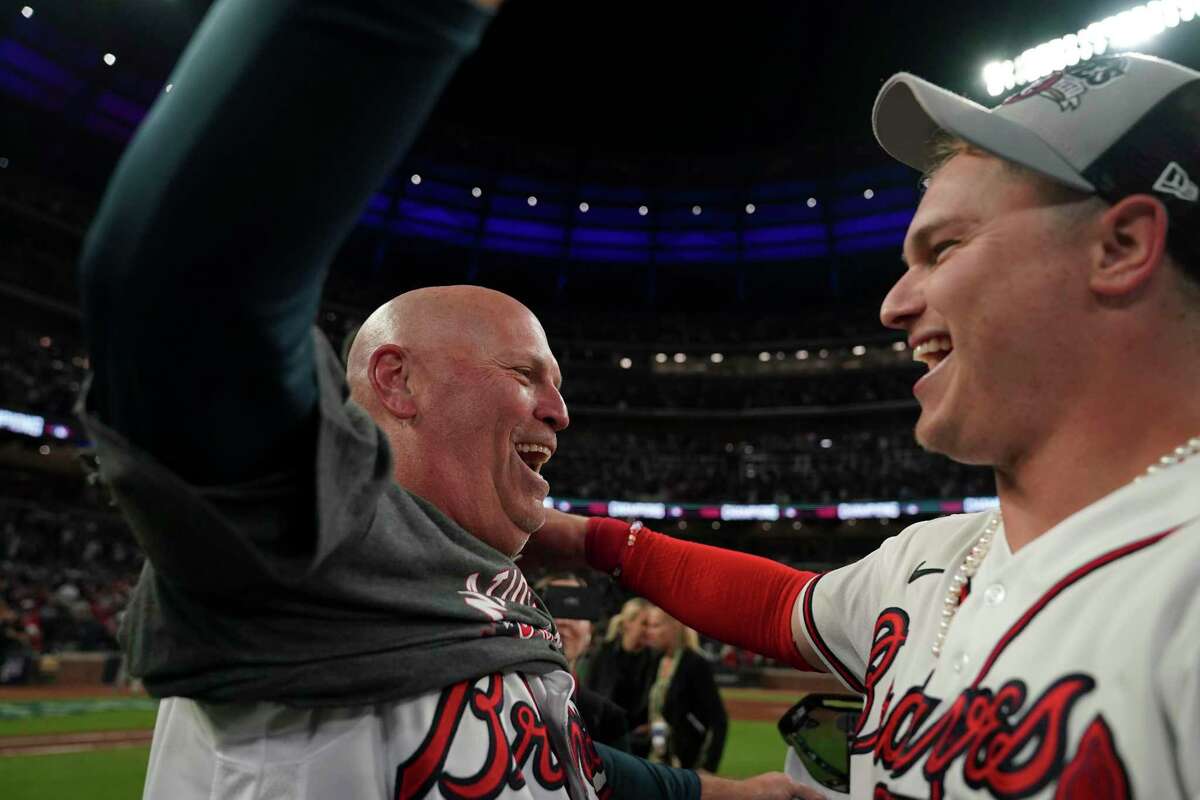 Atlanta Braves manager Brian Snitker celebrates a win over the Dodgers and a trip to Houston, where his son Troy is a hitting coach with the Astros.