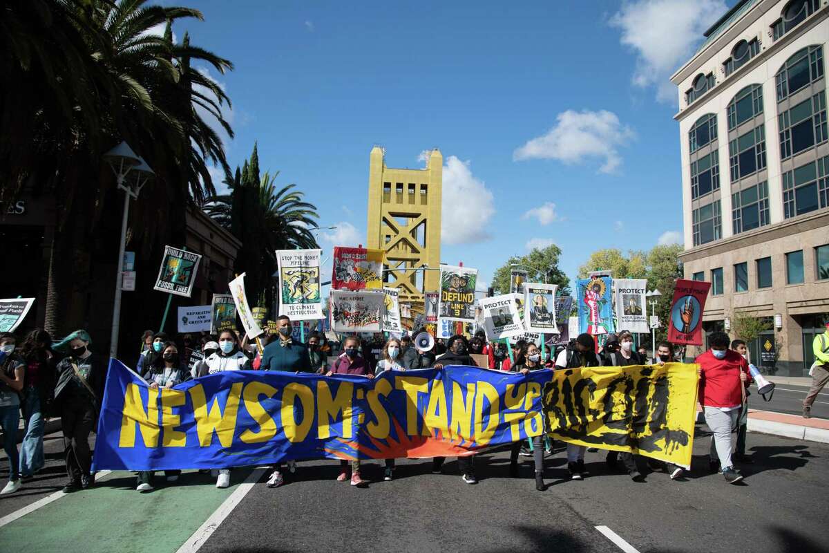 Activists march to the California Capitol in Sacramento on Friday.