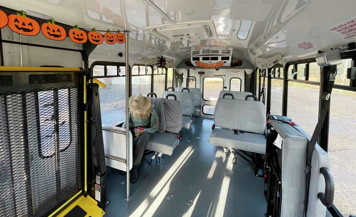 The staff at Mecosta Osceola Transit Authority decided to take some decorations and give one of the fleet's buses a Halloween theme -- equipped with a life-sized scarecrow. (Herald Review photo/Bradley Massman)