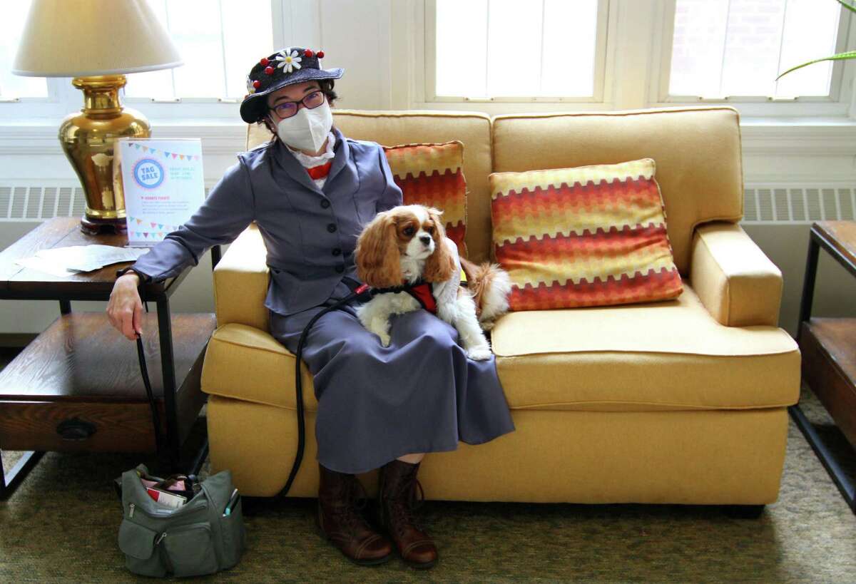 Angela Simpson, with Pet Partners, is dressed up as Mary Poppins with her dog Teddy.