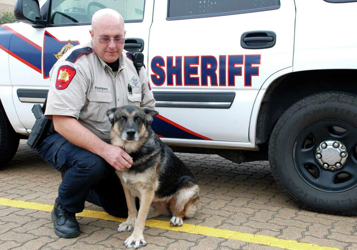 In this file photo, Montgomery County Sheriff's Office Deputy Tom Thompson is seen with K-9 Bianca.