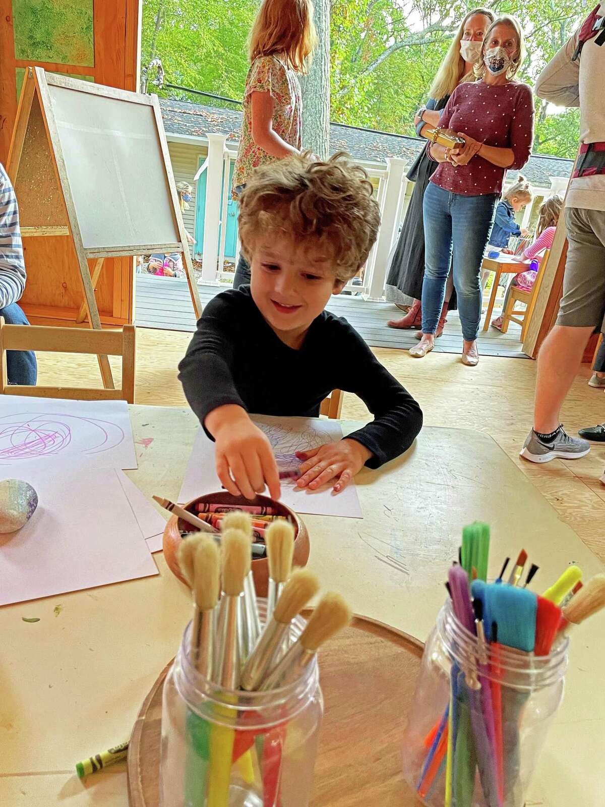 Griffin Barr is the one of the first artists to use the Community Nursery School’s outdoor art studio.