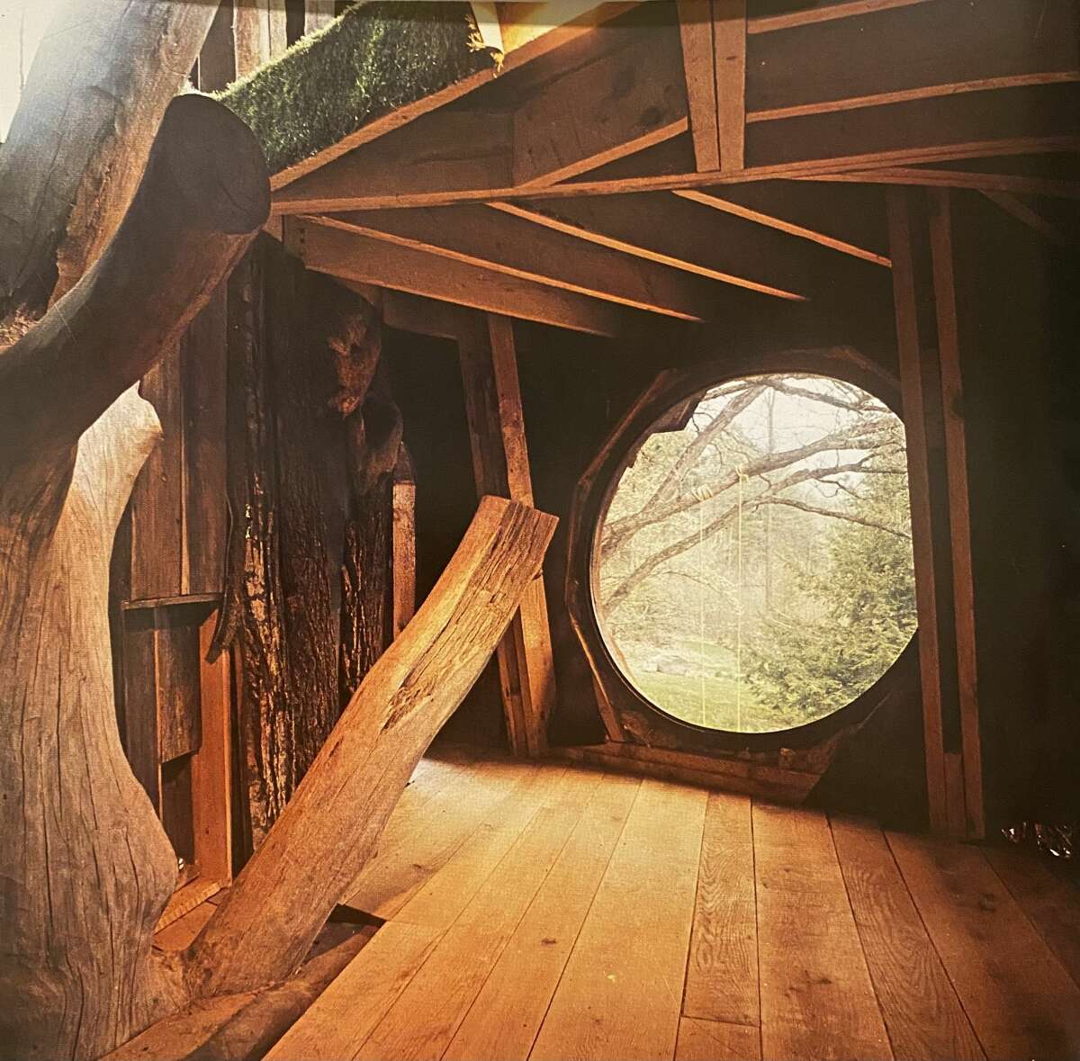 This handmade house was built around an old oak tree. Each home, reads the introduction of 'Woodstock Handmade Houses,' “was once a dream, a dream realized by imagination, hard work and the urge to build free and personally.”