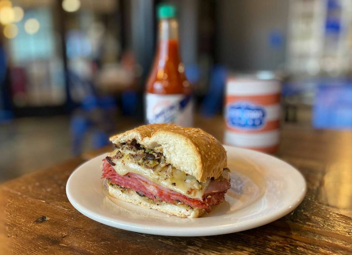 A classic muffuletta, made with housemade olive salad, capicola, salami, ham, Swiss and provolone and served on bread from Louisiana’s Gambino’s Bakery.