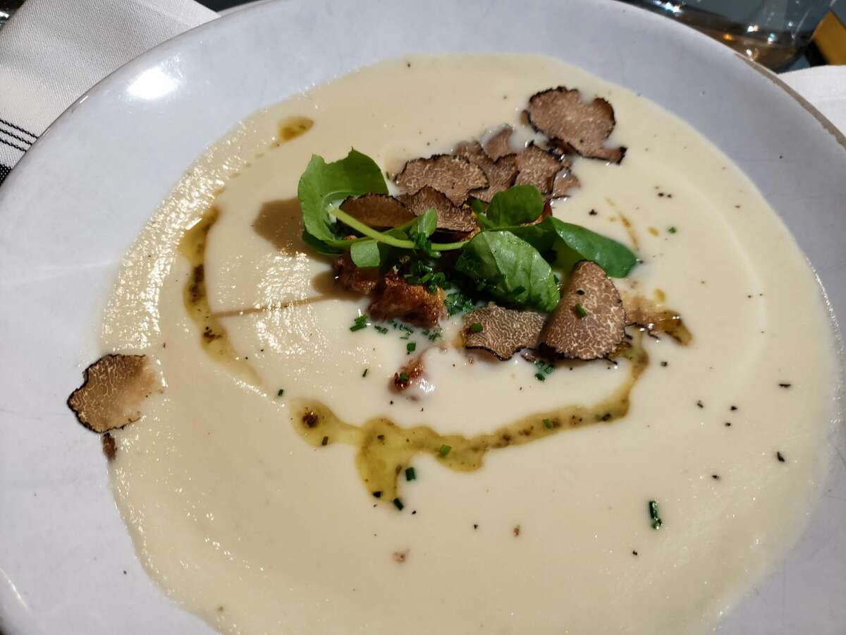 At The Tavern at Graybarns in Silvermine Chef Ben Freemole takes cauliflower soup upscale with winter truffle relish and a generous handful of shaved truffles.