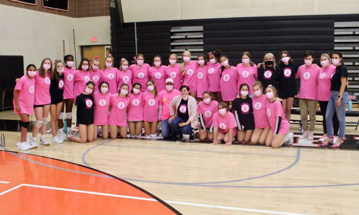 The Ridgefield High School girls volleyball team raised a record-breaking $4,600 for Ann’s Place in honor of Breast Cancer Awareness Month. Pictured is the team during its annual Dig Pink event on Monday, Oct. 18.