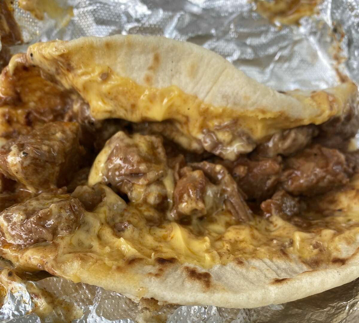 Carne guisada with cheese breakfast taco