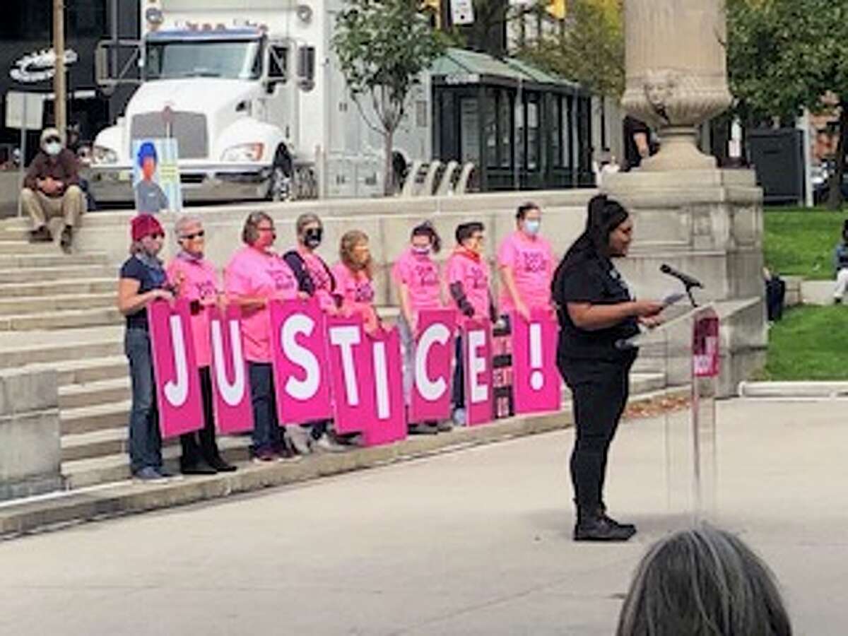EL Evelyn, In Our Own Voices' WSW (women who have sex with women) program coordinator, speaks at the Rally to Defend Abortion Access in Albany.