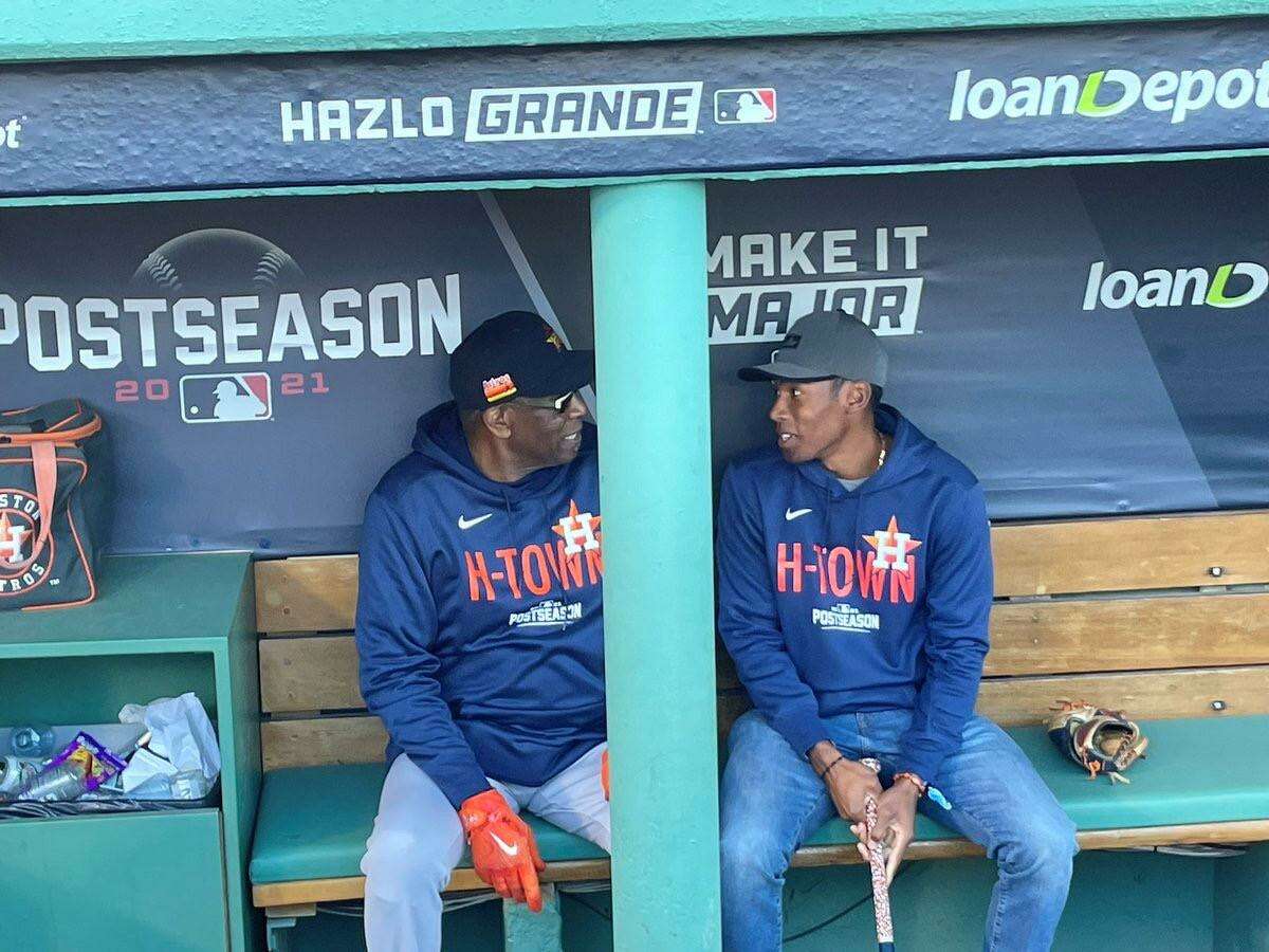 Dusty Baker and his son Darren in dugout at Fenway Park on Oct. 20.