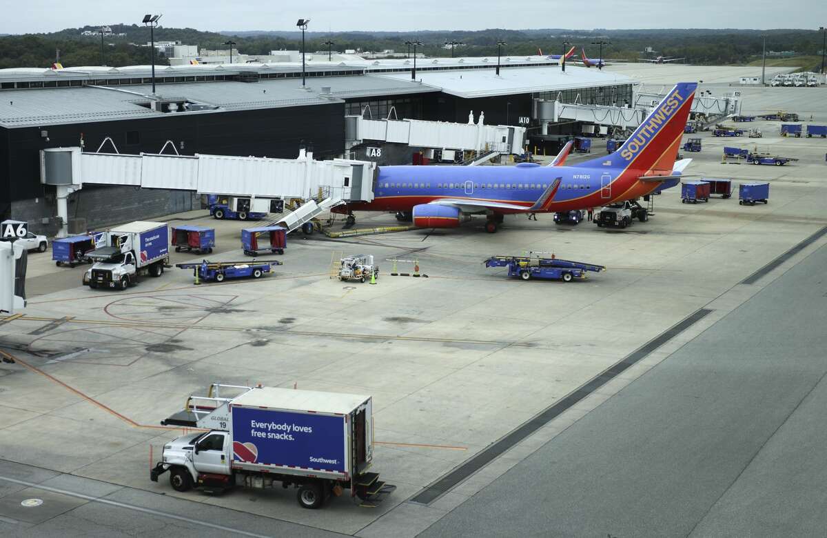 A Southwest Airlines airplane waits at a gate at Baltimore Washington International Thurgood Marshall Airport on October 11, 2021 in Baltimore, Maryland. (Photo by Kevin Dietsch/Getty Images)