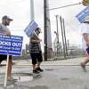 Locked out United Steel Workers Union members, including (from left) Carlos Soto, Adam Benavides and Zachary Simon, take their shift picketing outside Beaumont's ExxonMobil plant on Labor Day. Photo made Monday, September 6, 2021 Kim Brent/The Enterprise