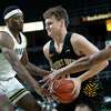 The College of Saint Rose’s Shane O’Dell drives to the basket against Siena’s Jared Billups, left, and Jordan Kellier during an exhibition game at the Times Union Center on Monday, Oct, 25, 2021 in Albany, N.Y.