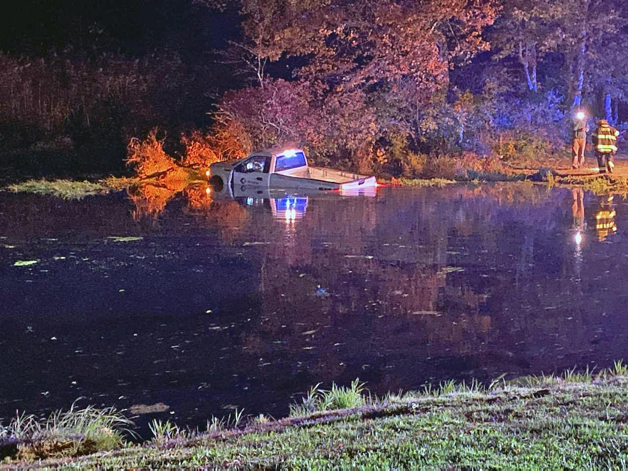 Police: Driver rescued after truck plunges into Easton pond