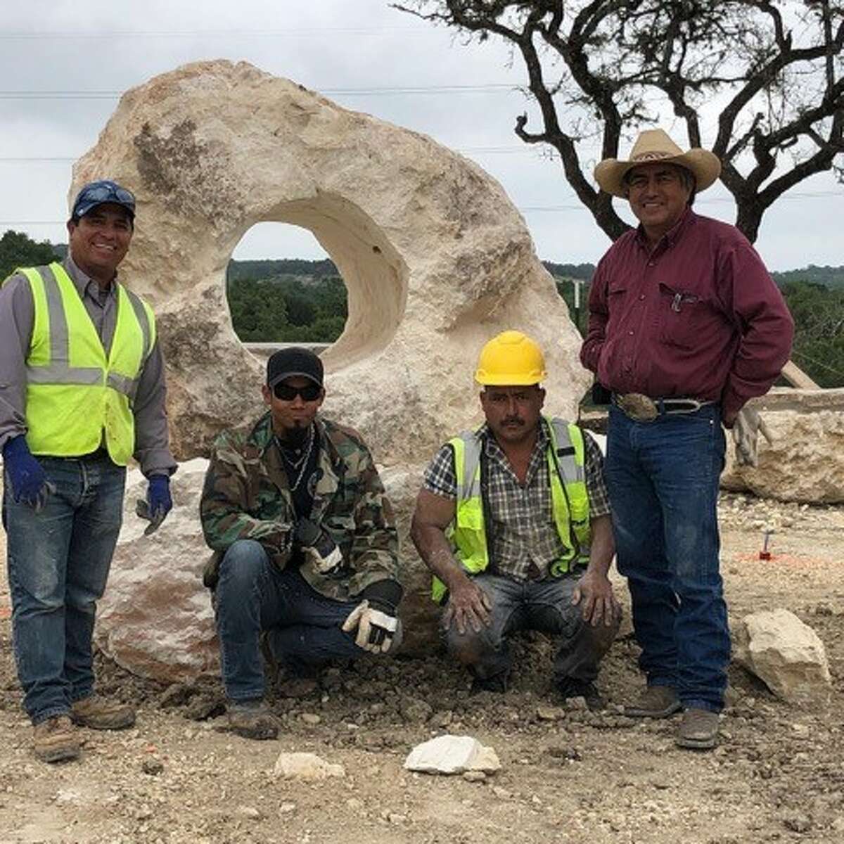 Esequiel “Chappo” Luevanos (far right), a Mexican-born artist whose work involved shaping massive limestone boulders into sculptures and furniture scattered across Texas Hill Country died on Oct. 17. He was 63. 