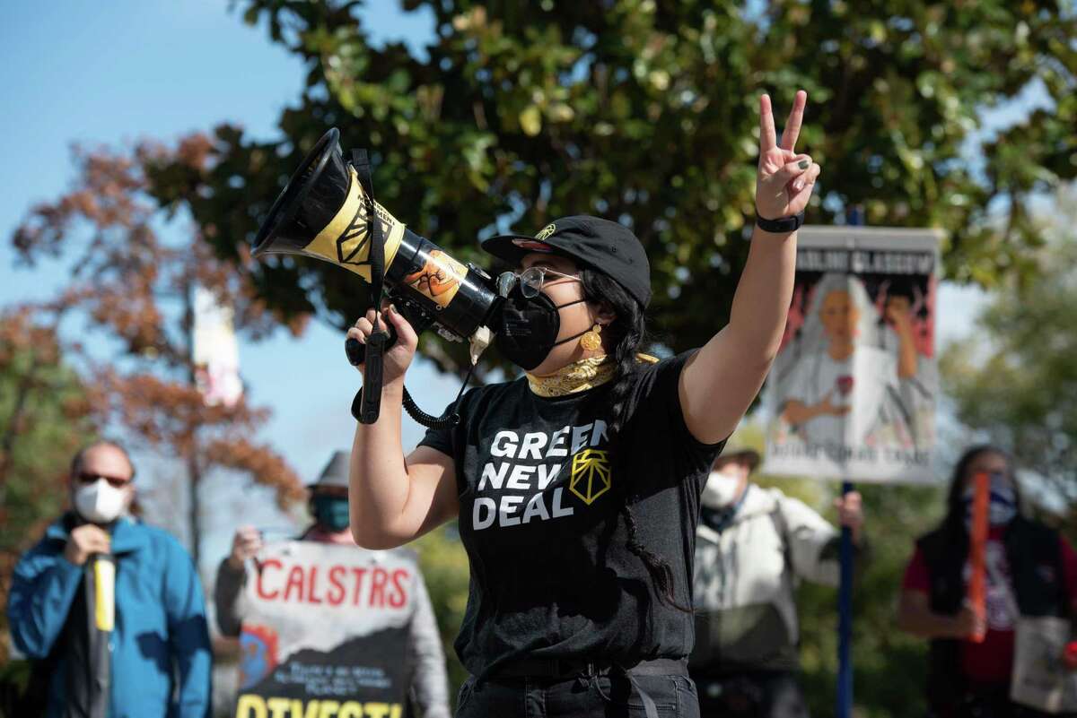 Megan Nguyen takes part in a protest in Sacramento on Friday demanding that the California Democratic Party ban accepting donations from fossil fuel and law enforcement organizations.