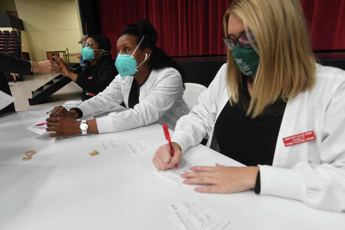 Nursing students from Lamar State College Orange, including (from left) Melissa Manning, Demetrice Johnson and Ashlen Robinson, helped with the operation of Hardin County's Monday morning COVID-19 vaccine clinic in Lumberton. The county is holding clinics as vaccine becomes available and trying to reach residents throughout the county by staging them at different locations. Photo taken Monday, February 8, 2021 Kim Brent/The Enterprise