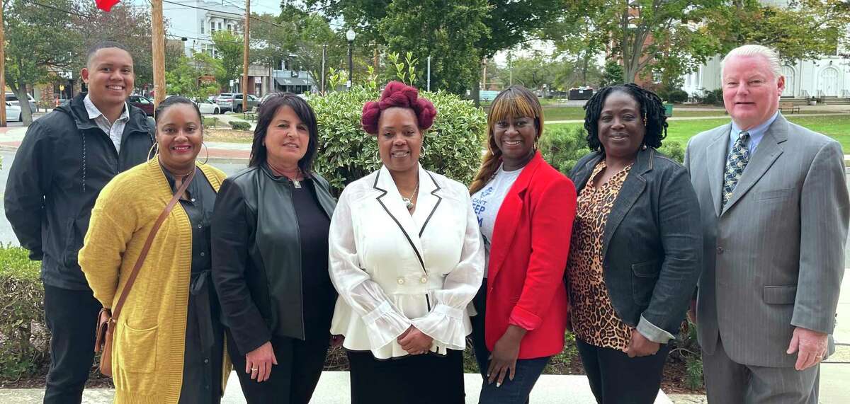 From left, West Haven Independent candidates Shane Brown, 6th District Council, Qaiyima McMillan, treasurer, Effie Prokopis, 8th District Council, Portia Bias, 7th District Council, Kerry-Ann Cross Murphy, Board of Education, Debbi Bell, 5th District Council, and George Monahan, Council-at-large, photographed in front of West Haven City Hall.