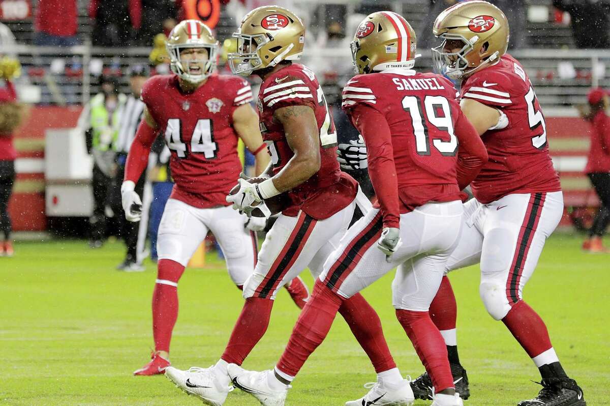 Teammates rush to celebrate Elijah Mitchell’s (25) touchdown in the first half as the San Francisco 49ers played the Indianapolis Colts at Levi’s Stadium.